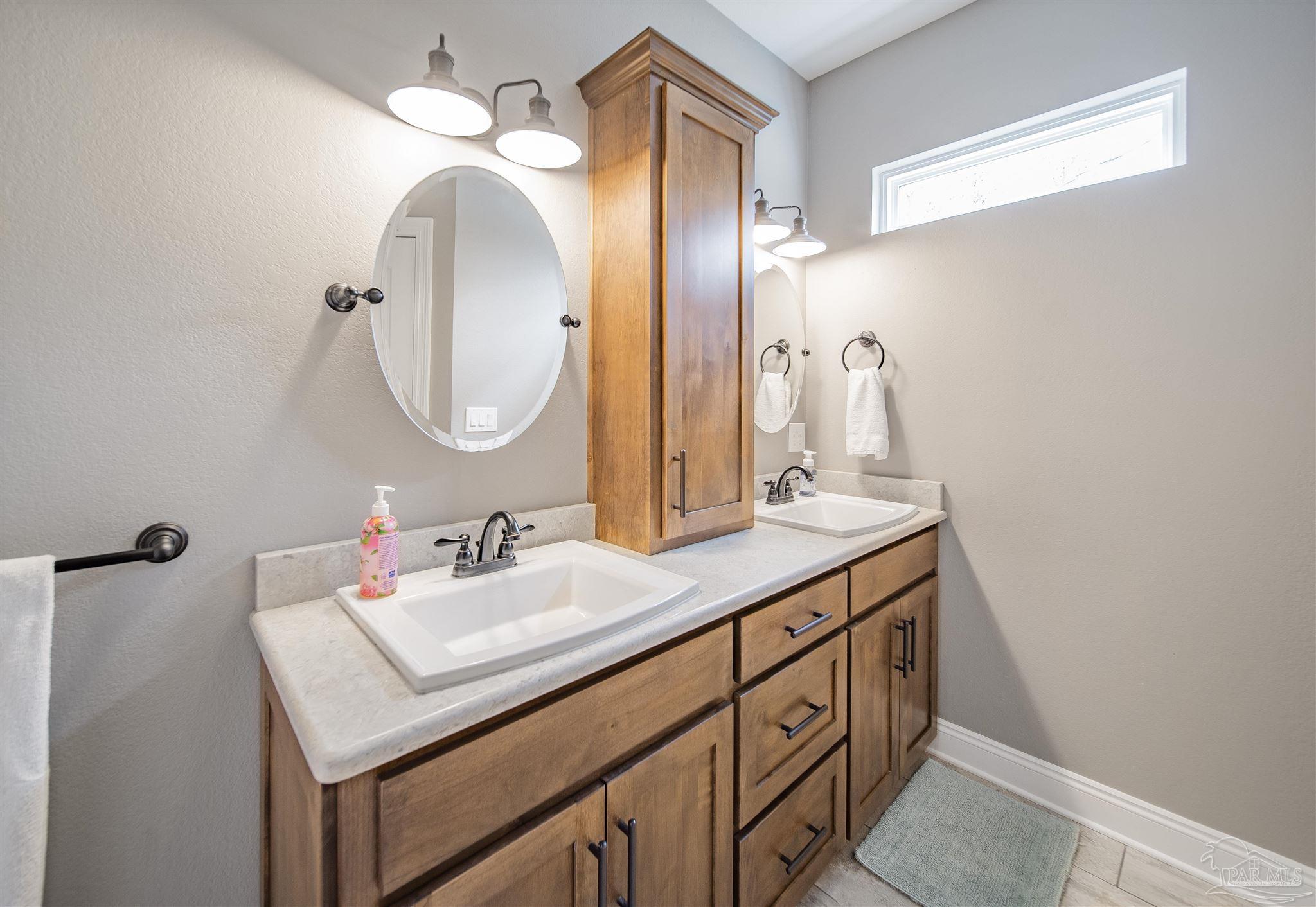 2800 Dunsford Road Jay, FL 32565 - Photo 16 of 42 a bathroom with a sink and a mirror
