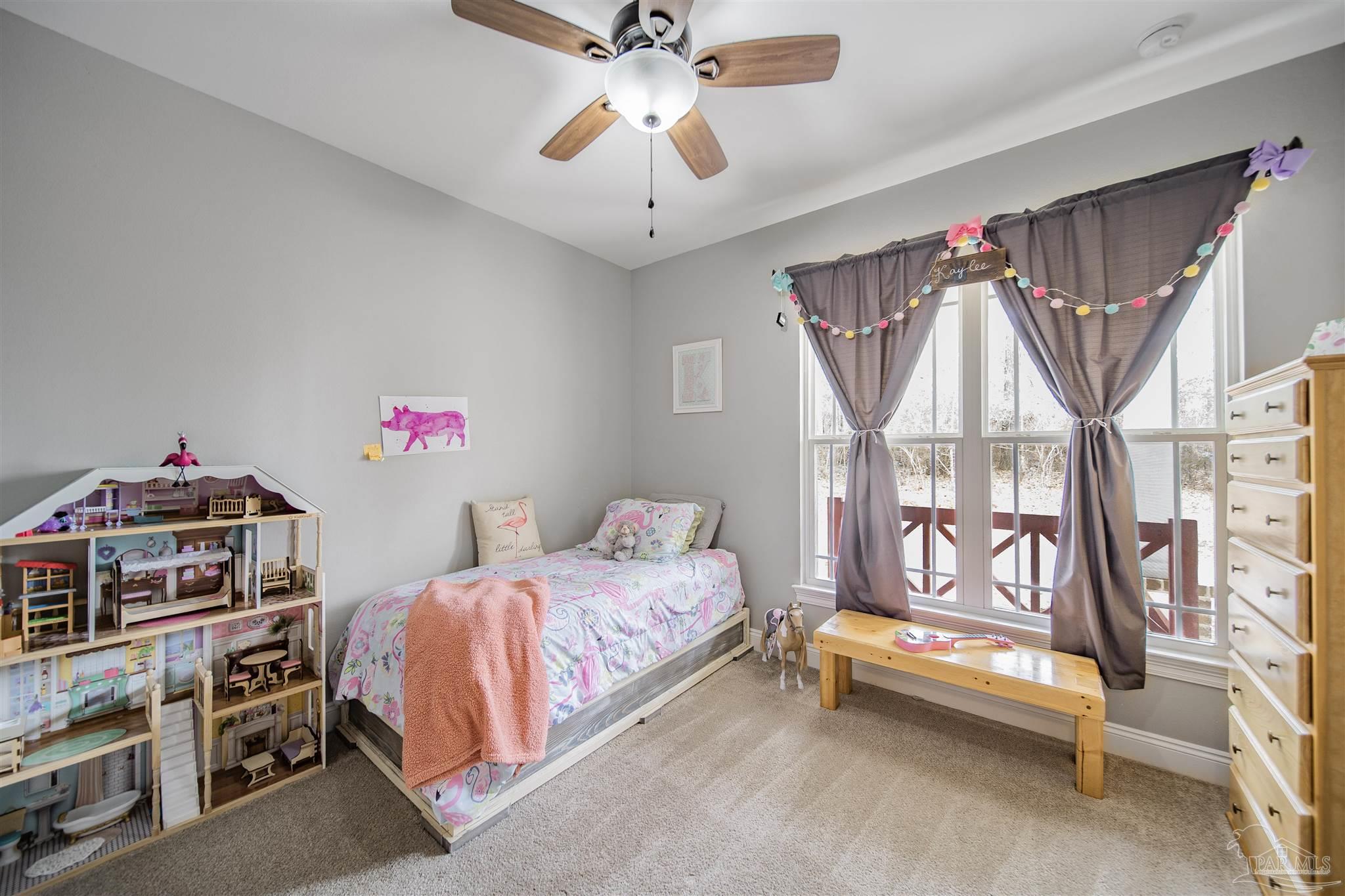 2800 Dunsford Road Jay, FL 32565 - Photo 20 of 42 a bedroom with furniture and a window