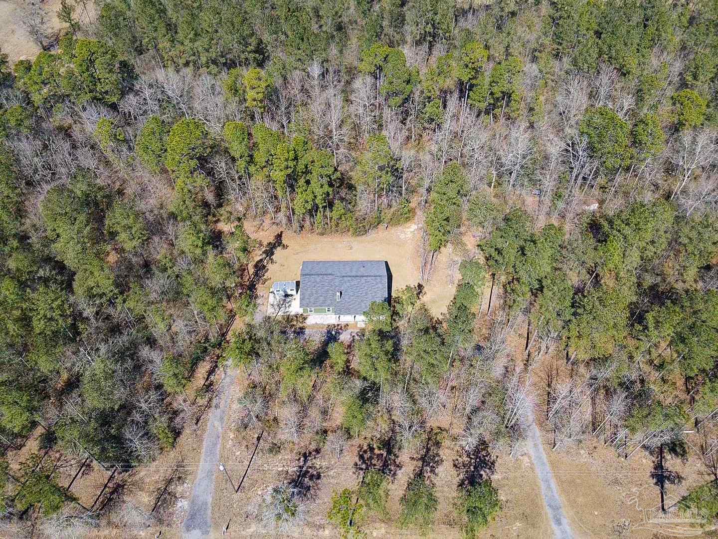 2800 Dunsford Road Jay, FL 32565 - Photo 2 of 42 a view of a wooden wall under a tree