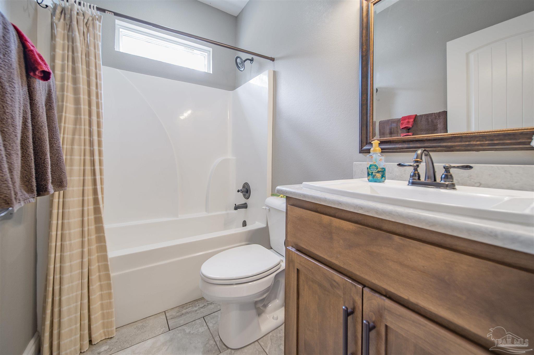 2800 Dunsford Road Jay, FL 32565 - Photo 22 of 42 a bathroom with a sink a toilet and a bathtub