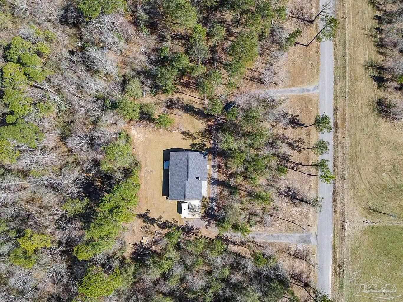 2800 Dunsford Road Jay, FL 32565 - Photo 37 of 42 a aerial view of a house with a yard and large tree