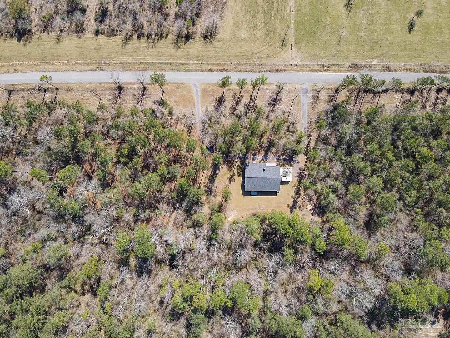 2800 Dunsford Road Jay, FL 32565 - Photo 38 of 42 a view of a yard with wooden fence