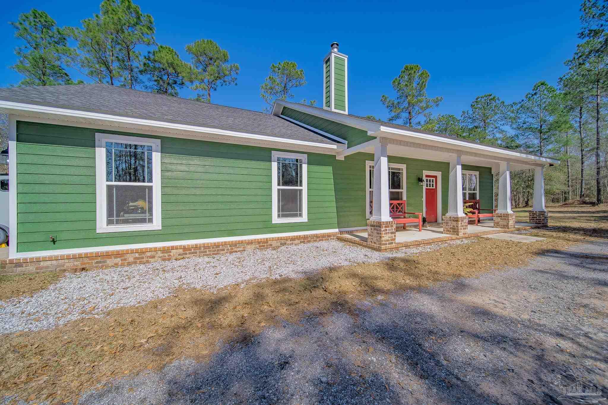 2800 Dunsford Road Jay, FL 32565 - Photo 4 of 42 a view of a house with a backyard and porch