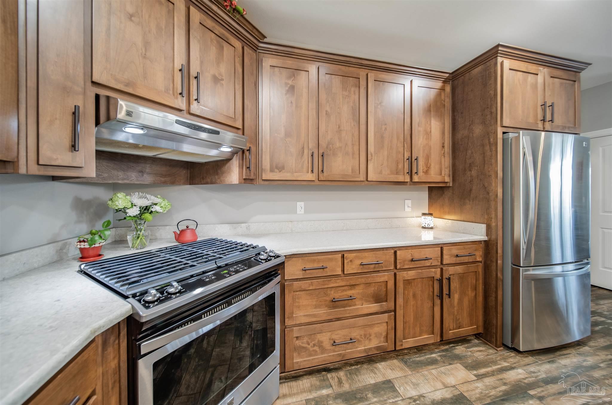 2800 Dunsford Road Jay, FL 32565 - Photo 7 of 42 a kitchen with a stove and a refrigerator