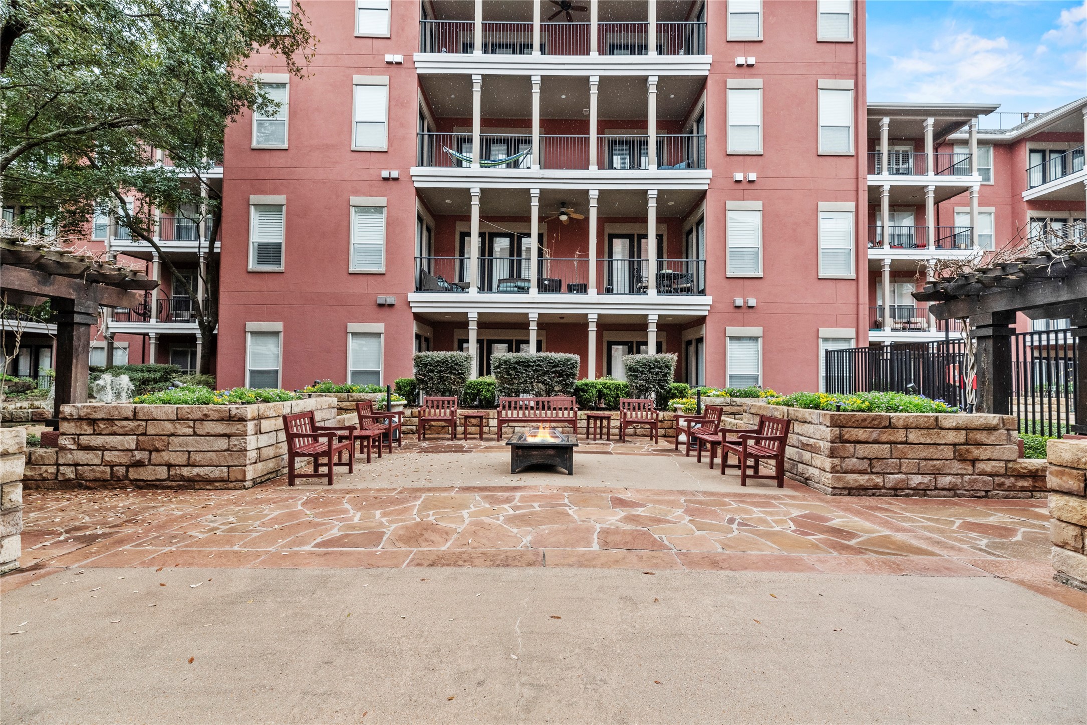 2400 McCue Road, Unit 206 Houston, TX 77056 - Photo 14 of 17 The beautiful courtyard is a perfect setting for hanging out with friends around the fire pit. There is a grill area for cooking out by the pool!