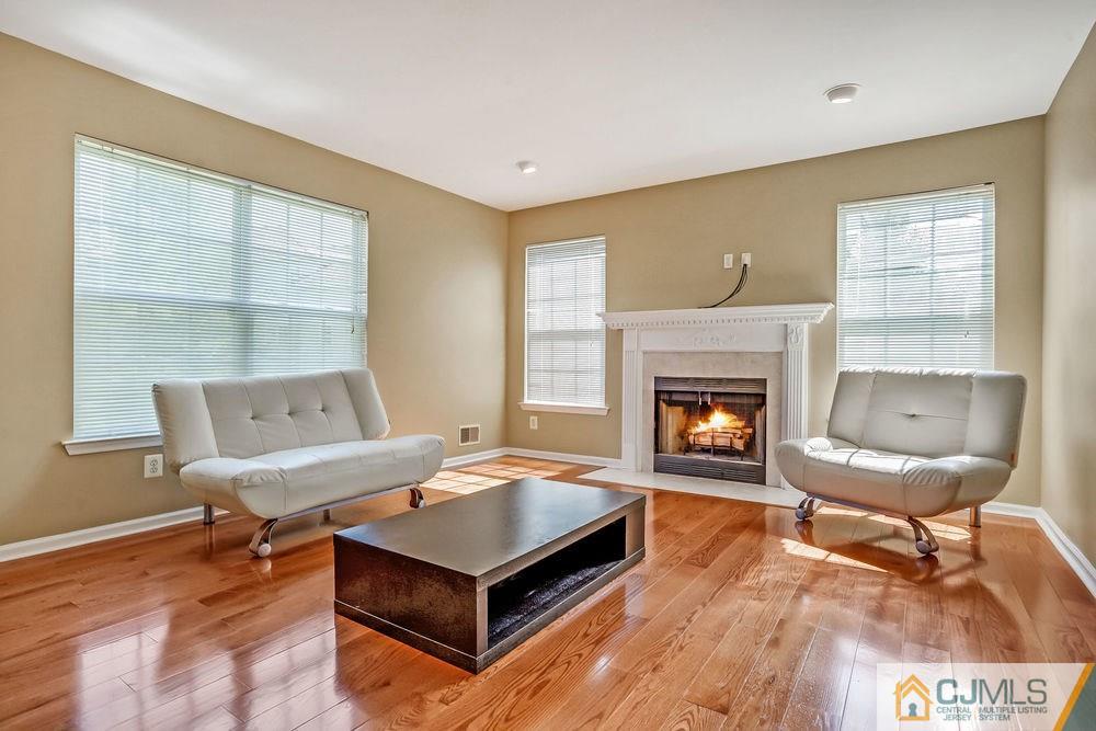 23 Mapleton Road Old Bridge, NJ 08857 - Photo 13 of 24 a living room with furniture and a fireplace