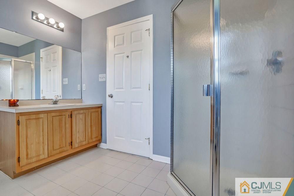 23 Mapleton Road Old Bridge, NJ 08857 - Photo 19 of 24 a bathroom with a sink and a mirror