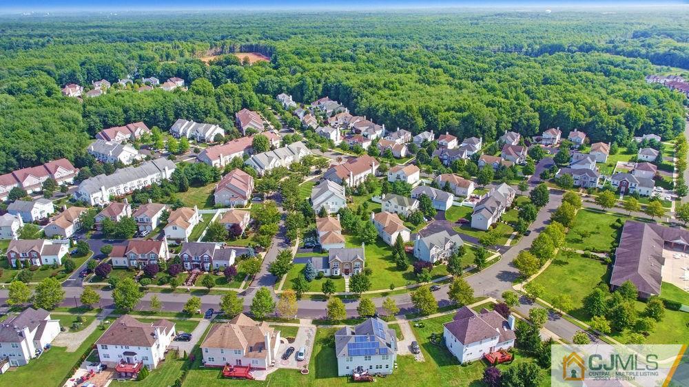 23 Mapleton Road Old Bridge, NJ 08857 - Photo 3 of 24 an aerial view of residential houses with outdoor space and trees