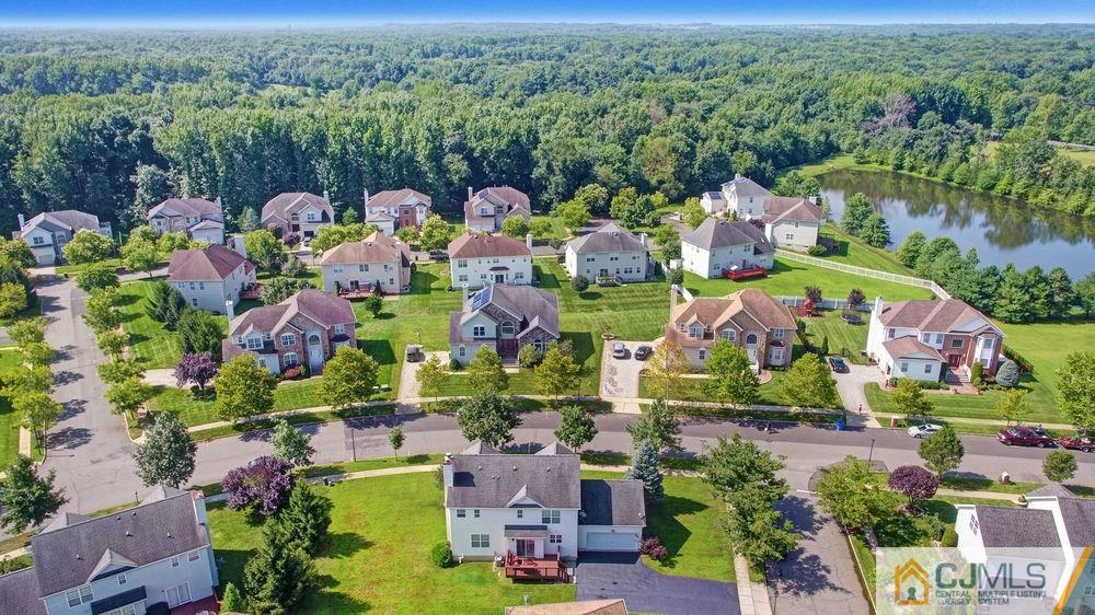 23 Mapleton Road Old Bridge, NJ 08857 - Photo 4 of 24 an aerial view of a house with a lot of trees