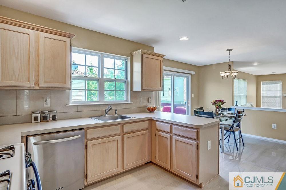 23 Mapleton Road Old Bridge, NJ 08857 - Photo 10 of 24 a kitchen with a sink stove and cabinets