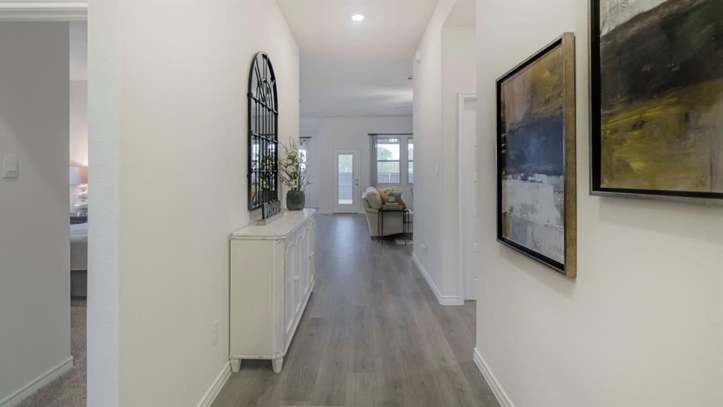 410 Range Road Caddo Mills, TX 75135 - Photo 7 of 19 Long hallway featuring wood-finish flooring, recessed lighting, and crisp white walls