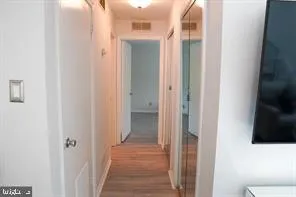 a view of a bathroom from a corridor