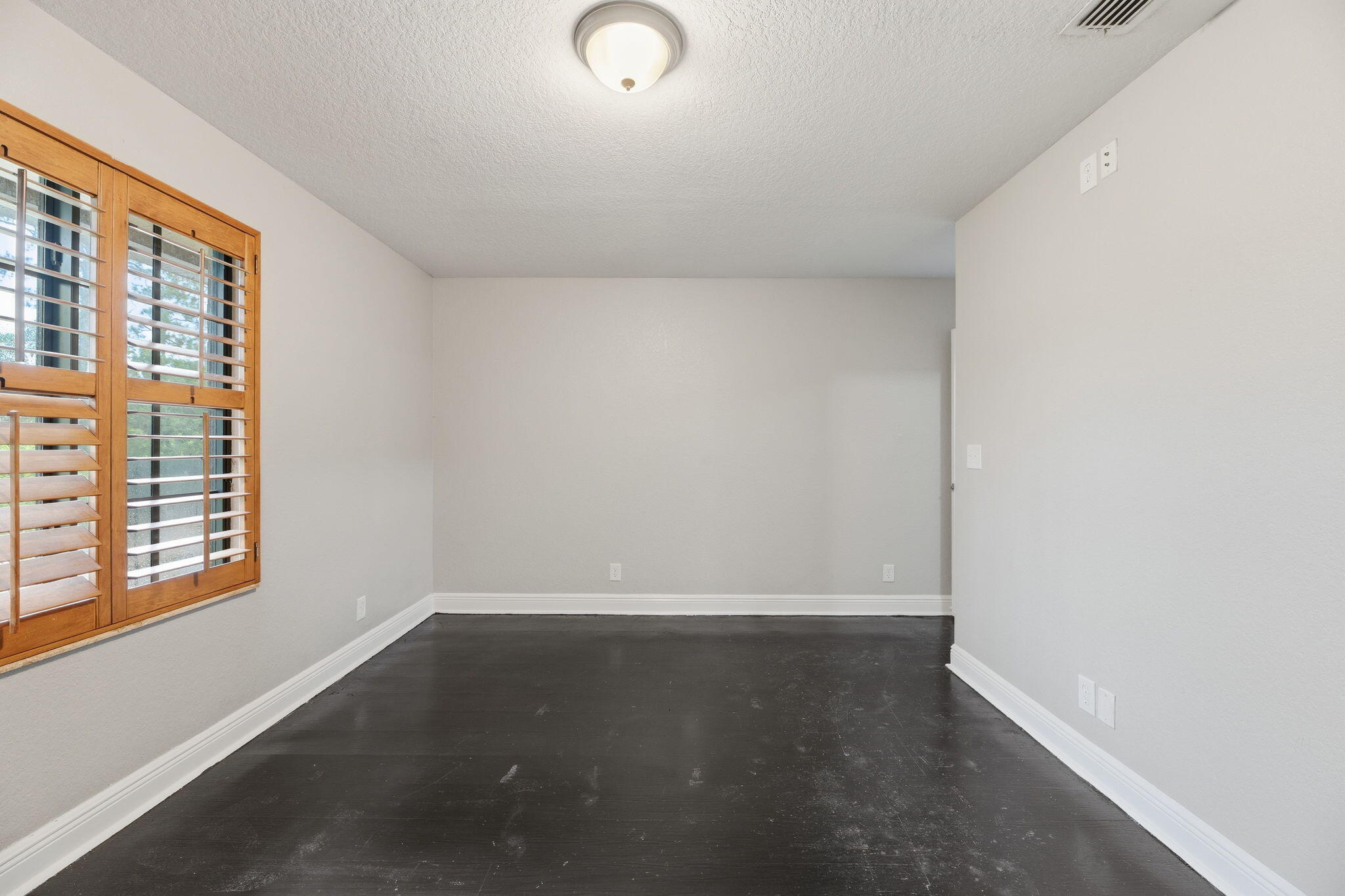 15731 85th Road North Loxahatchee, FL 33470 - Photo 30 of 65 an empty room with wooden floor and windows