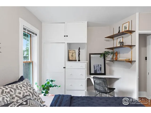 a workspace with furniture and window