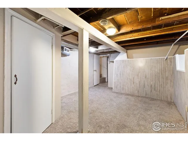 a view of a room with wooden walls