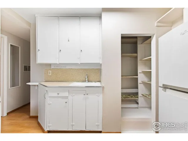 a view of cabinets with wooden floor