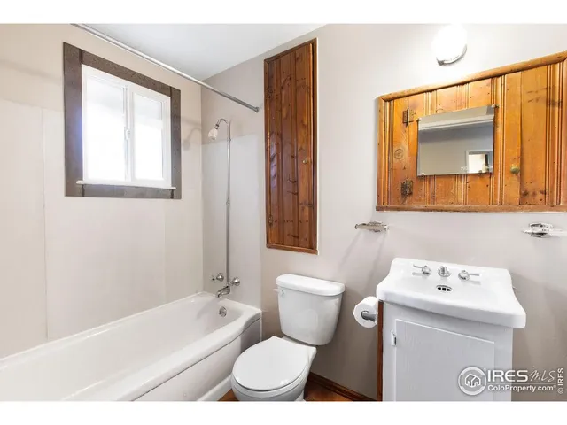 a bathroom with a toilet a sink and a bathtub