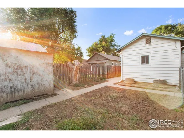 a view of a backyard of the house