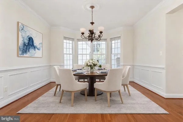 a living room with furniture and a kitchen