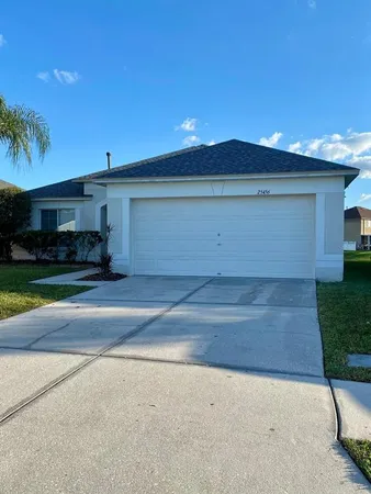 a view of garage and yard
