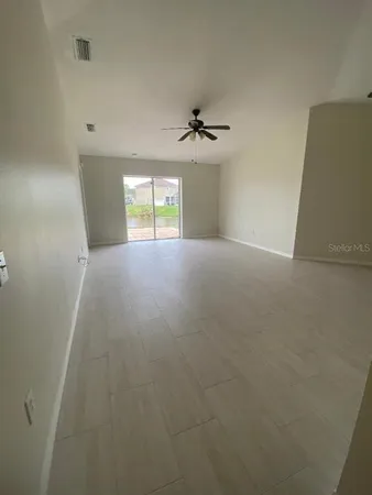 a view of empty room with windows