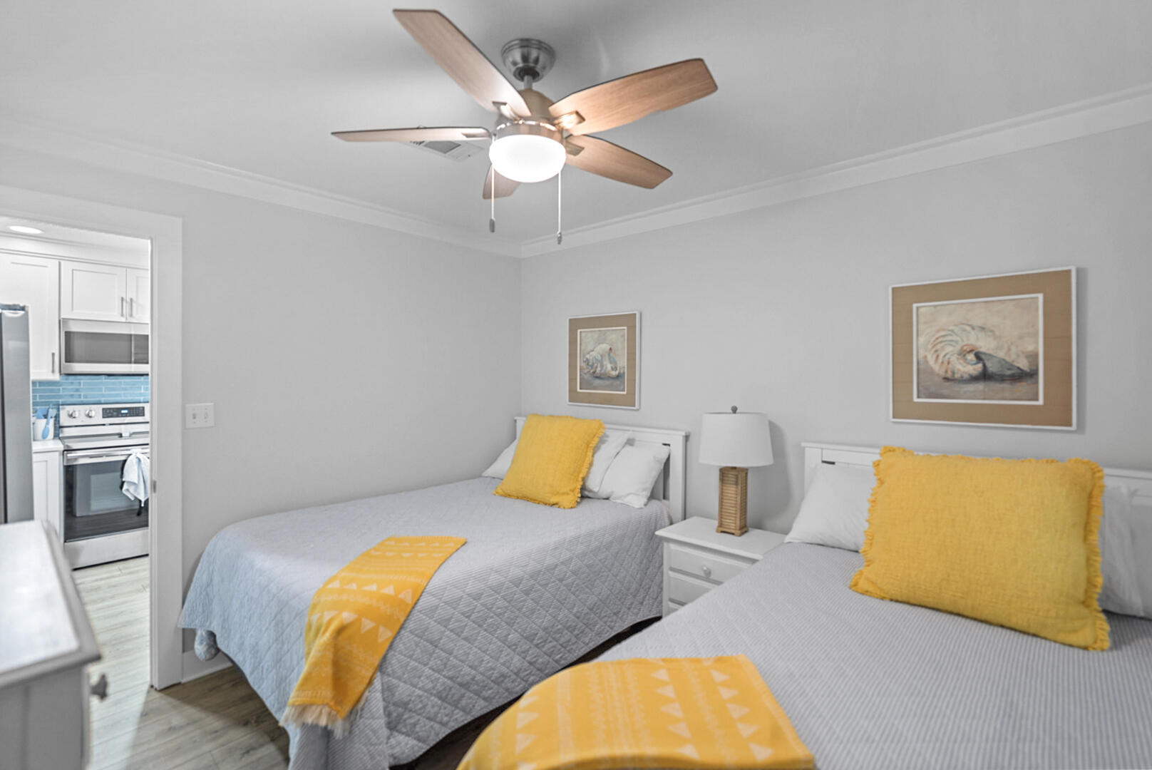 11 Beachside Drive, Unit 123 Santa Rosa Beach, FL 32459 - Photo 18 of 22 a bedroom with a bed couch and a lamp on a dresser