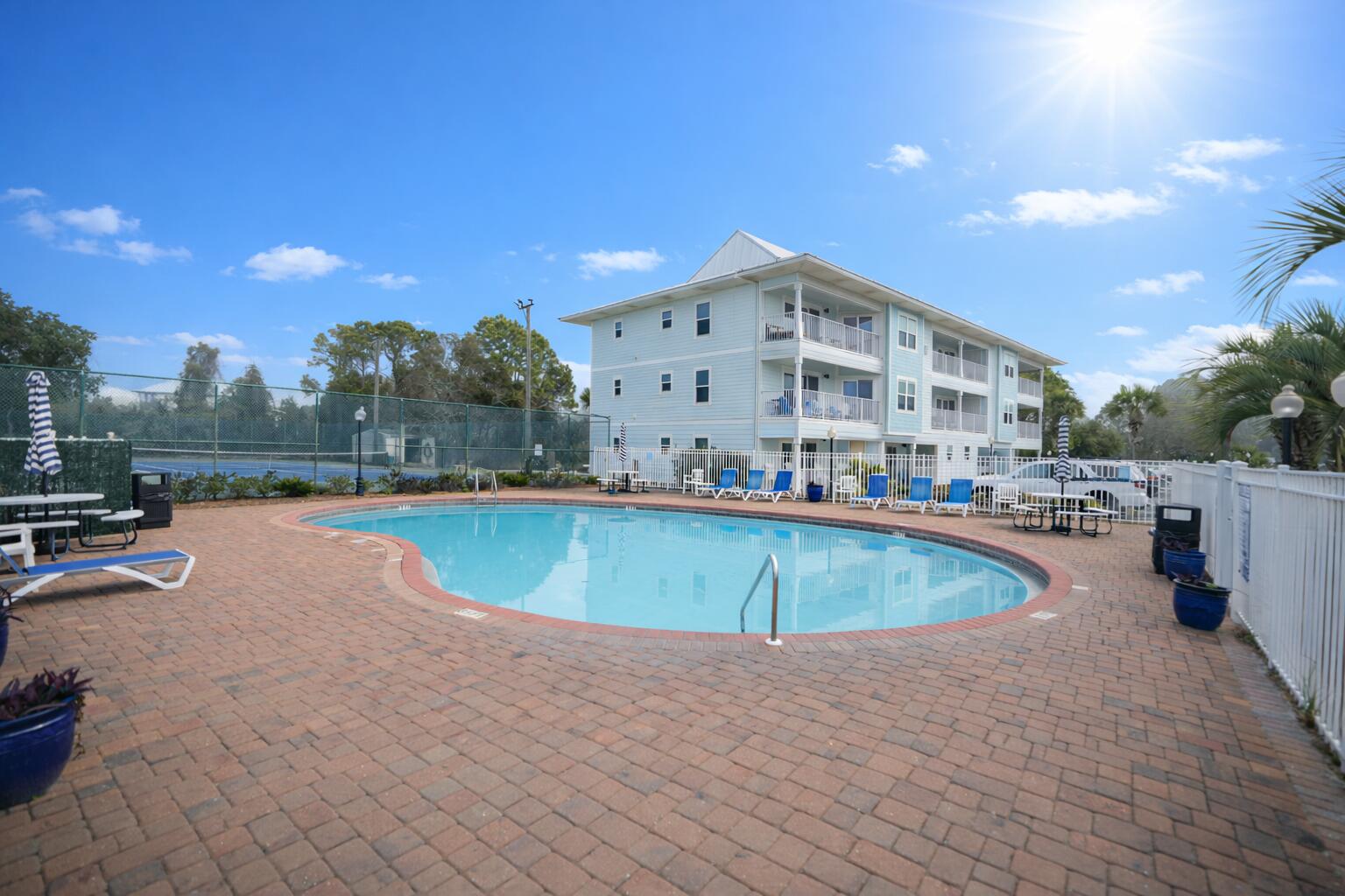 11 Beachside Drive, Unit 123 Santa Rosa Beach, FL 32459 - Photo 21 of 22 a view of a swimming pool with a yard