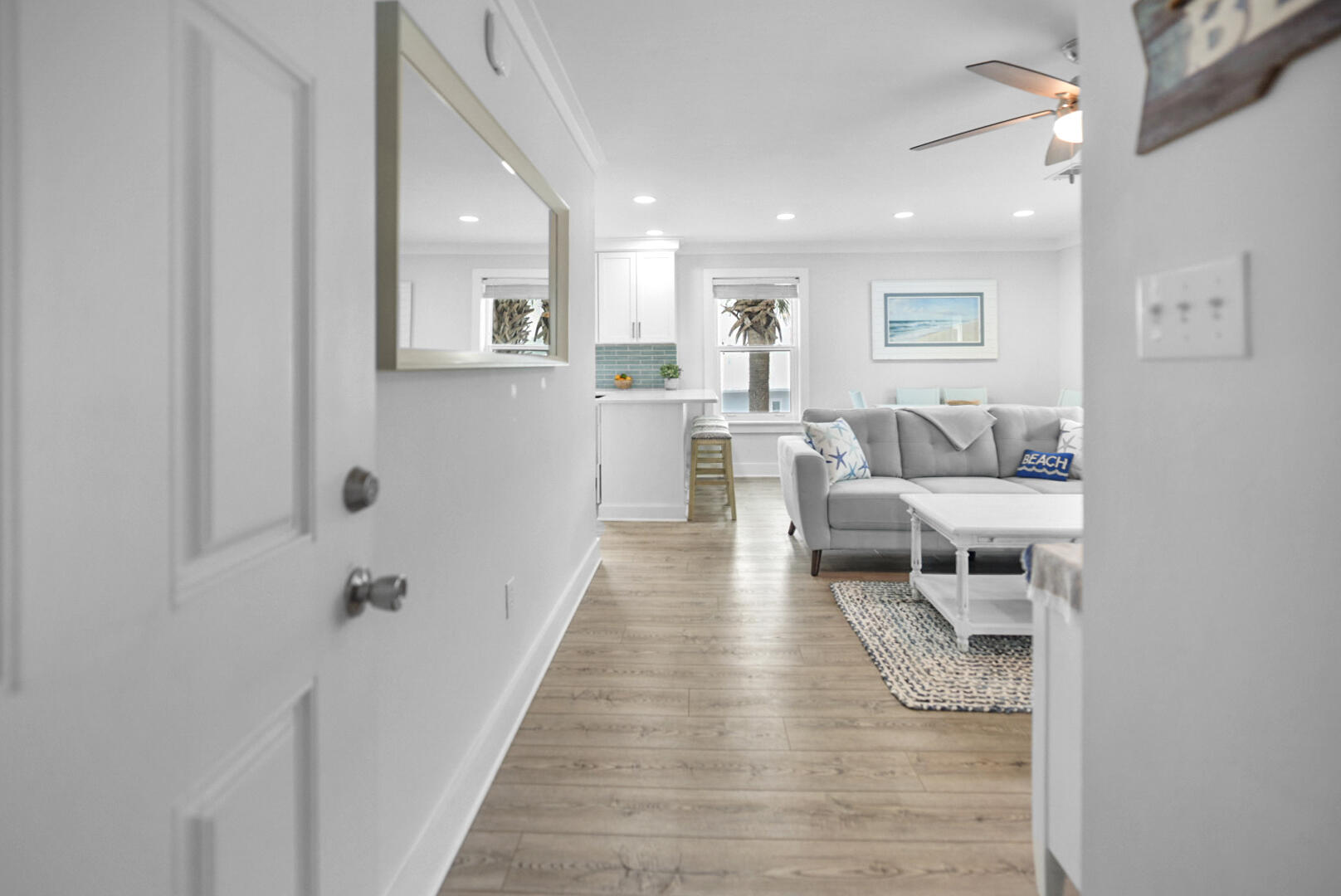 11 Beachside Drive, Unit 123 Santa Rosa Beach, FL 32459 - Photo 3 of 22 a living room with furniture and wooden floor