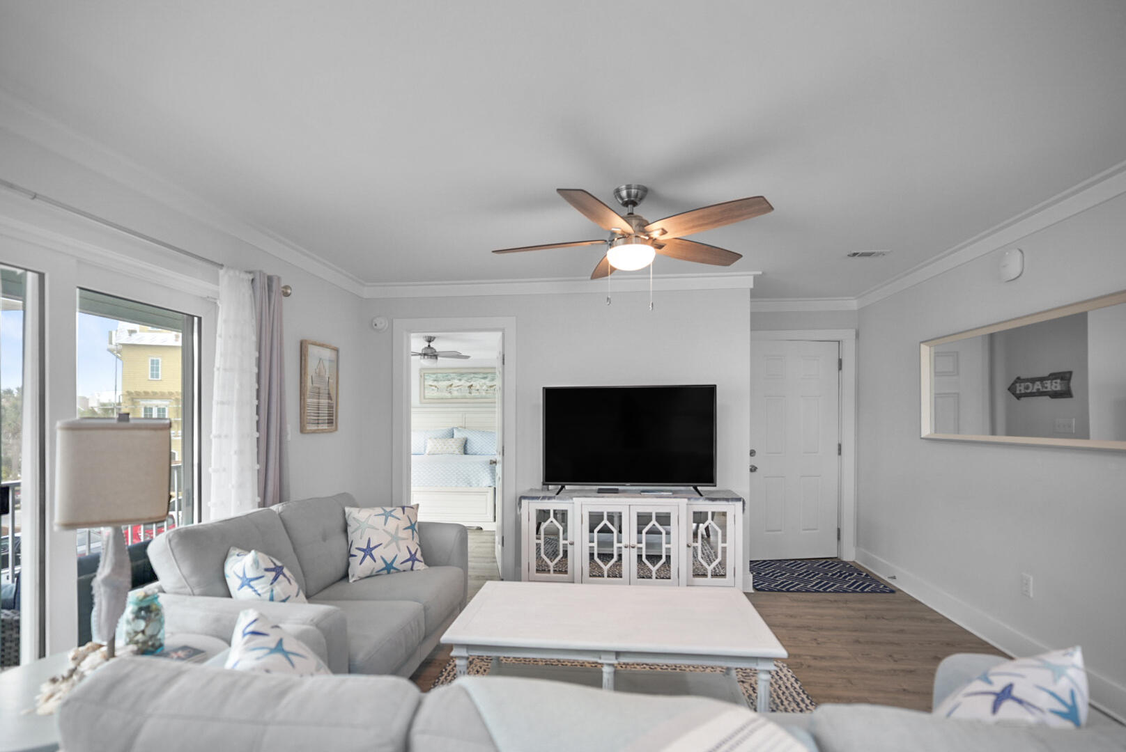 11 Beachside Drive, Unit 123 Santa Rosa Beach, FL 32459 - Photo 5 of 22 a living room with furniture and a flat screen tv