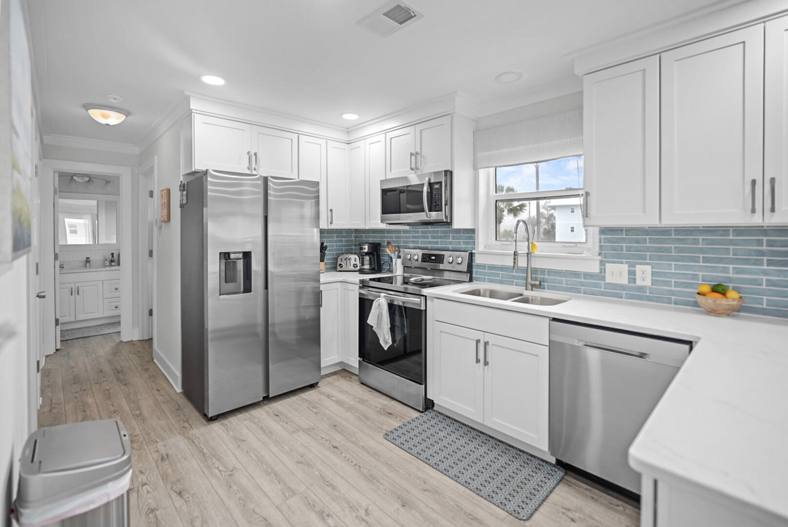11 Beachside Drive, Unit 123 Santa Rosa Beach, FL 32459 - Photo 6 of 22 a kitchen with stainless steel appliances a refrigerator sink and cabinets