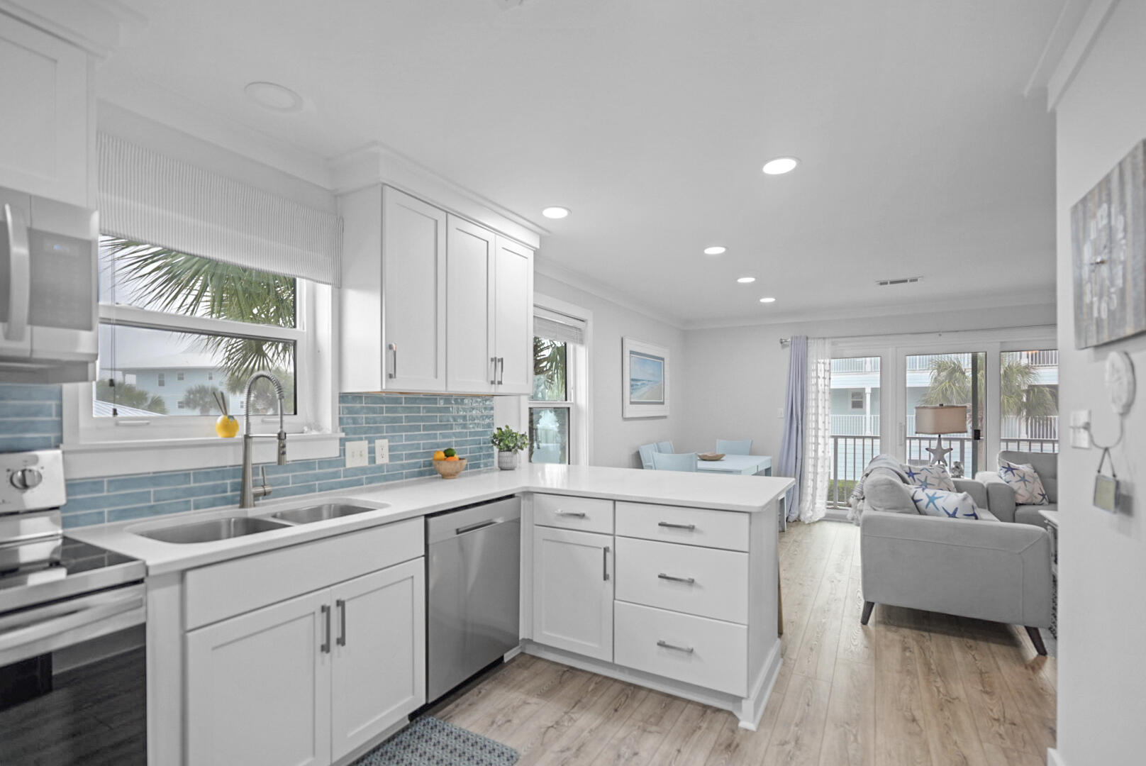 11 Beachside Drive, Unit 123 Santa Rosa Beach, FL 32459 - Photo 7 of 22 a kitchen with a sink stove and cabinets
