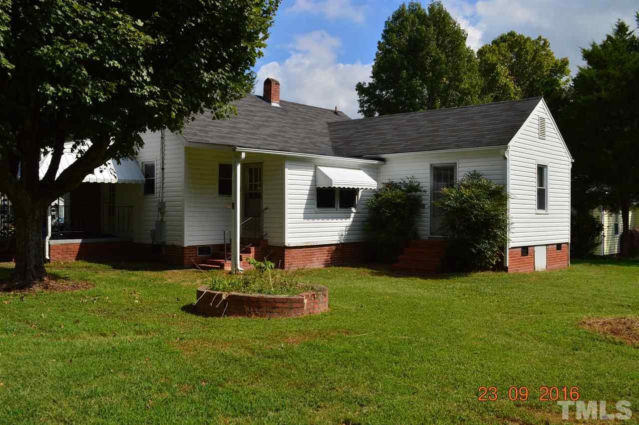 195 Cavel Chub Lake Road Roxboro, NC 27574 - Photo 22 of 25 a front view of a house with a yard