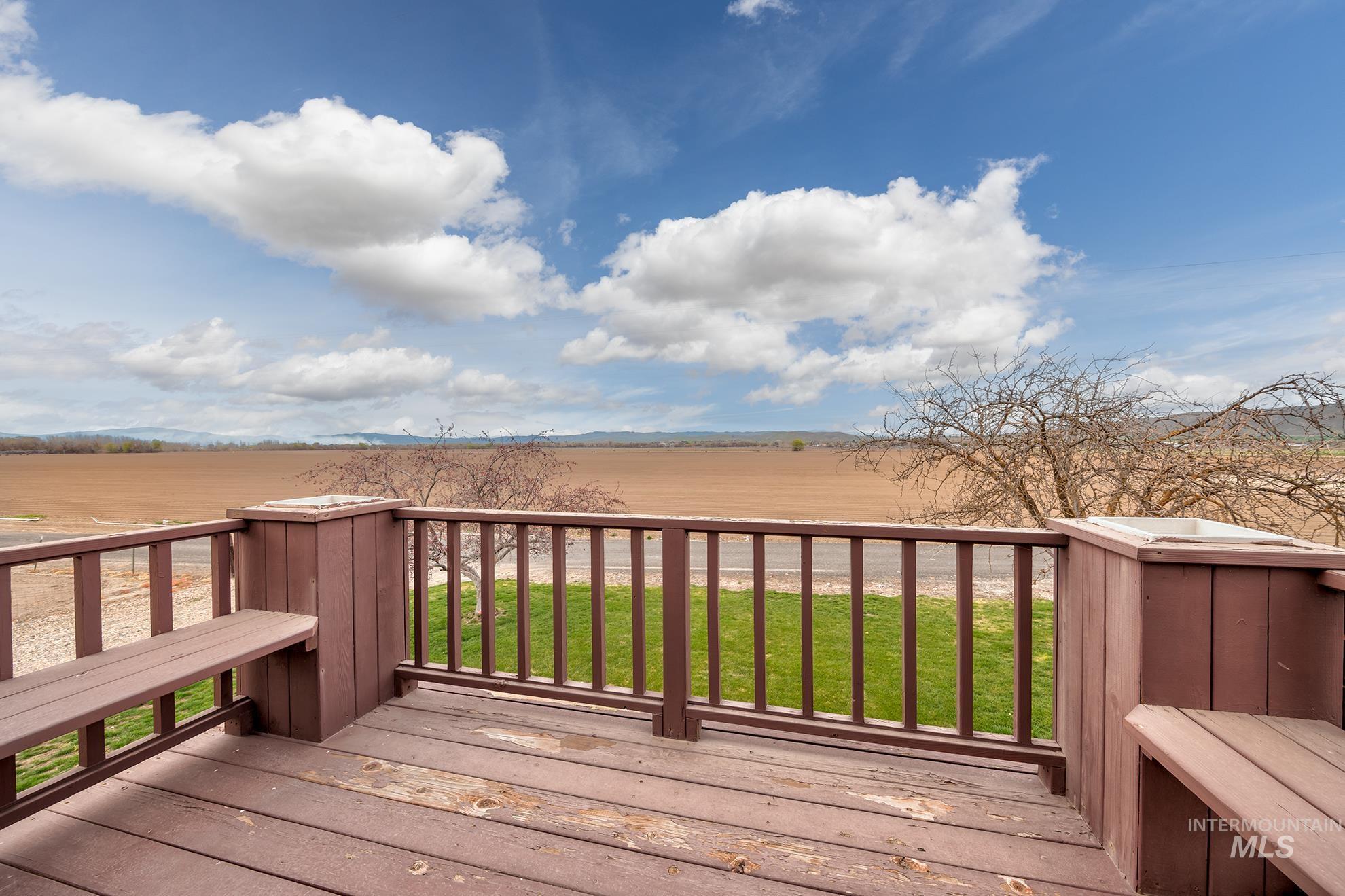 1363 Ross Road Weiser, ID 83672 - Photo 19 of 47 Wooden deck featuring a yard and a view of rural / pastoral area