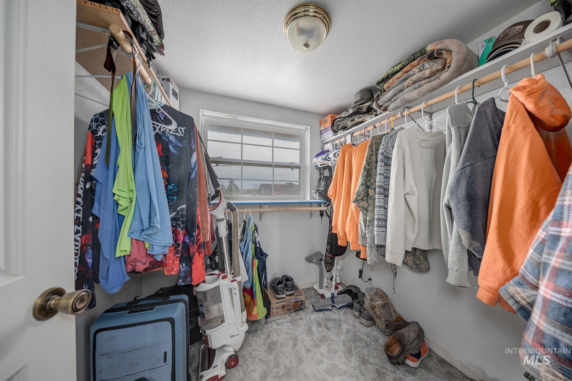 1363 Ross Road Weiser, ID 83672 - Photo 20 of 47 Walk in closet featuring light carpet