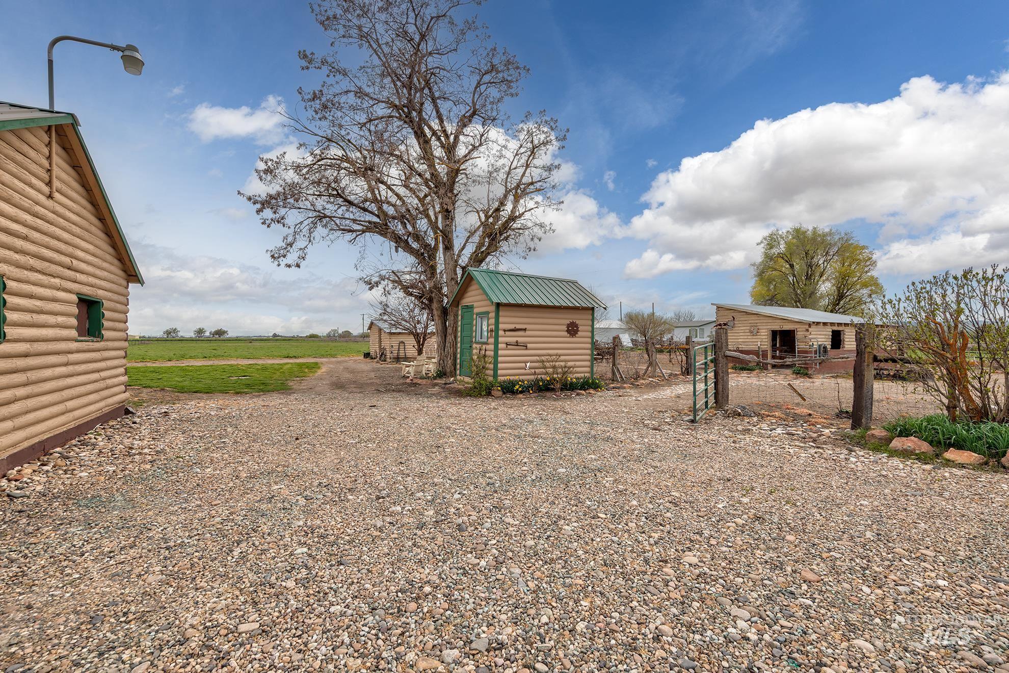 1363 Ross Road Weiser, ID 83672 - Photo 33 of 47 View of yard featuring driveway, a shed, and a gate