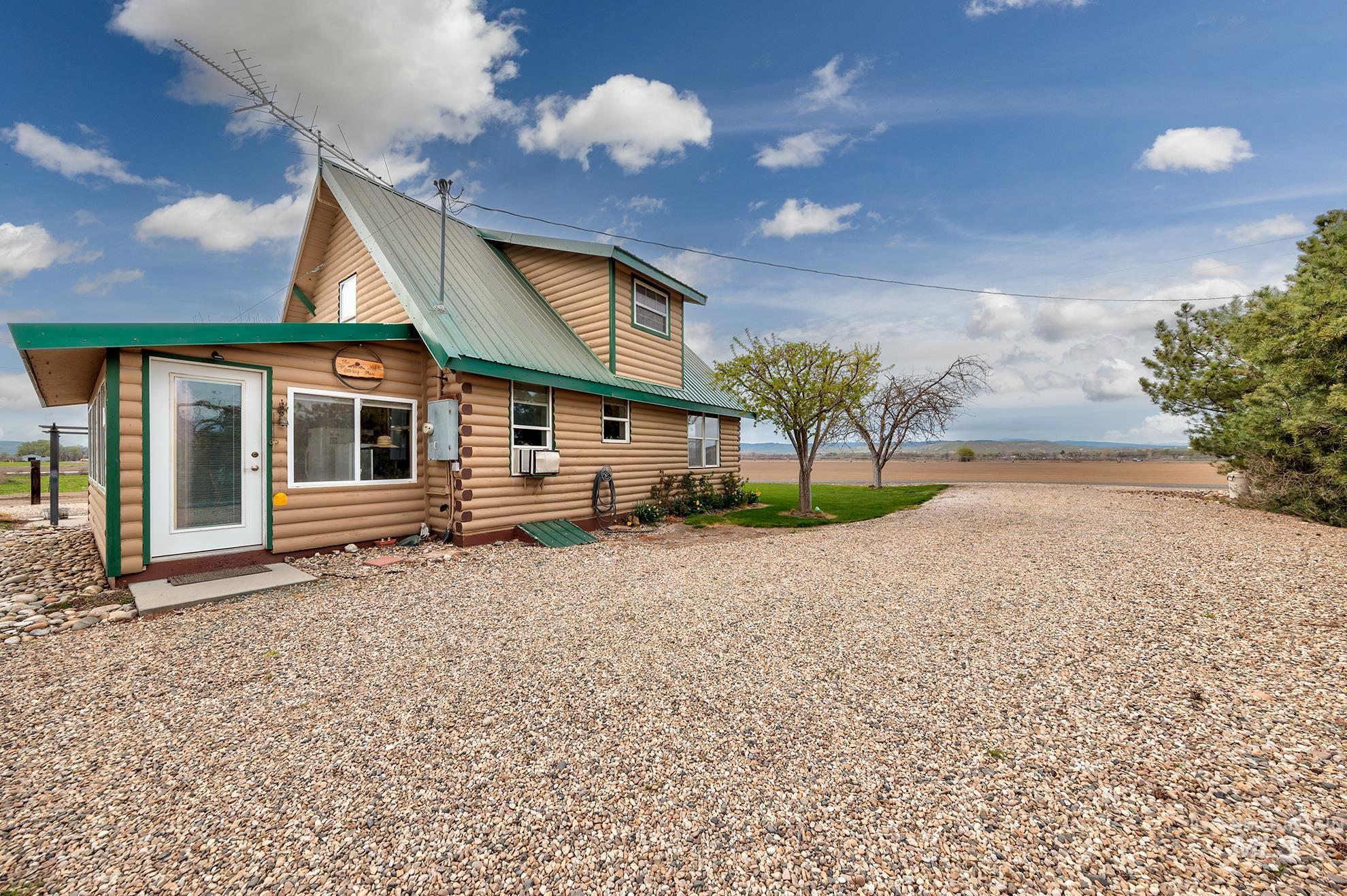 1363 Ross Road Weiser, ID 83672 - Photo 41 of 47 Back of property featuring log siding and a metal roof