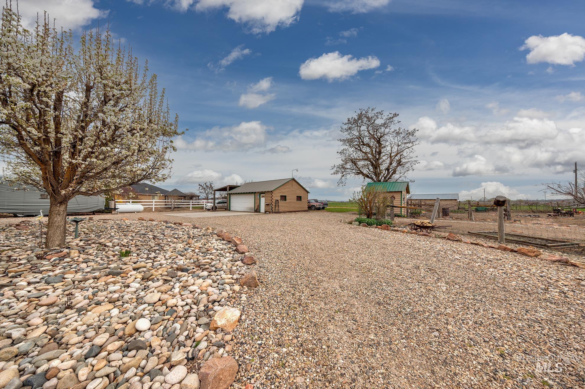 1363 Ross Road Weiser, ID 83672 - Photo 42 of 47 View of yard with an outbuilding and gravel driveway