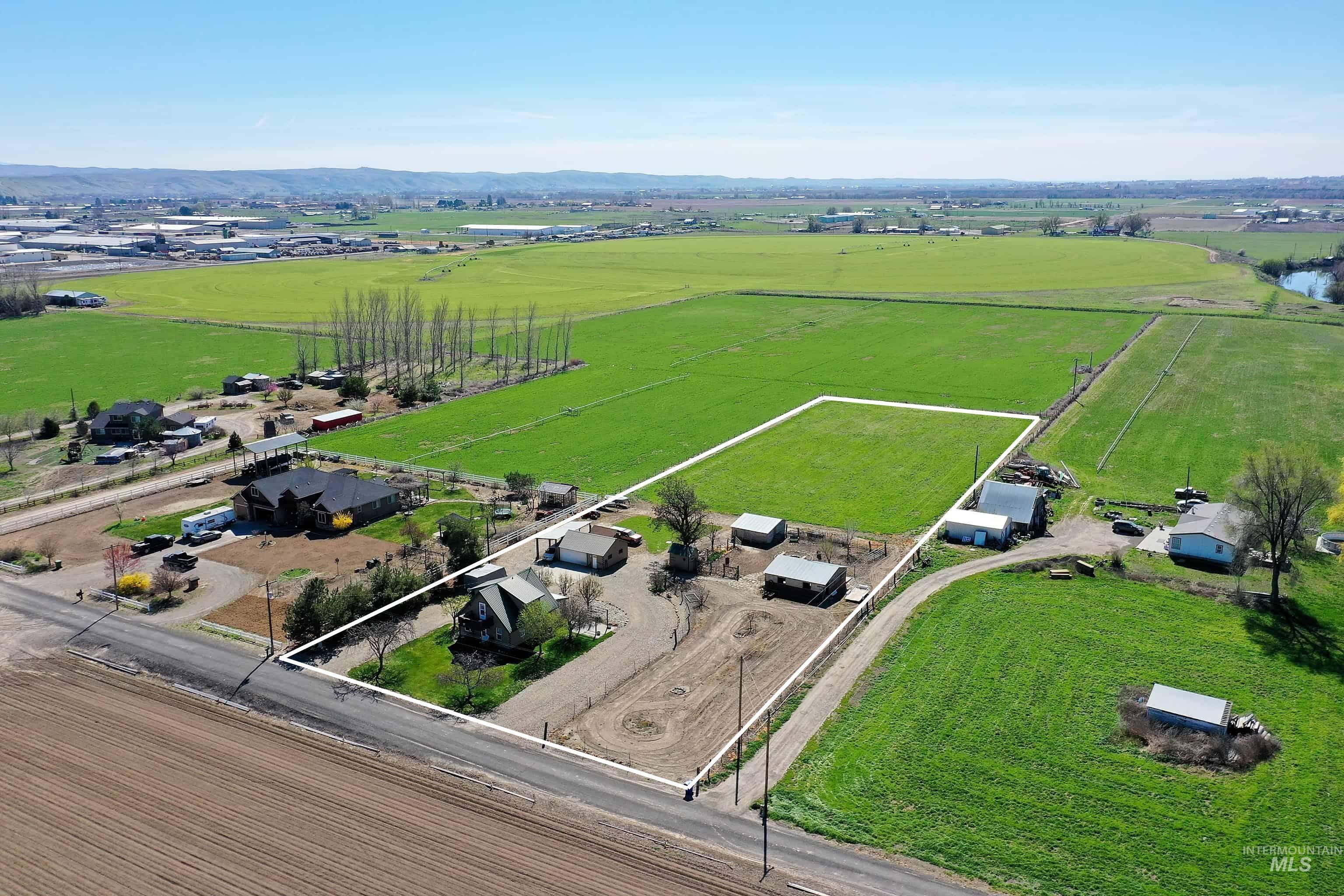 1363 Ross Road Weiser, ID 83672 - Photo 47 of 47 Aerial view of sparsely populated area featuring property parcel outlined, mountains, and abundant farmland