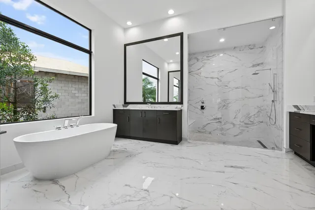 a bathroom with a bathtub and a shower