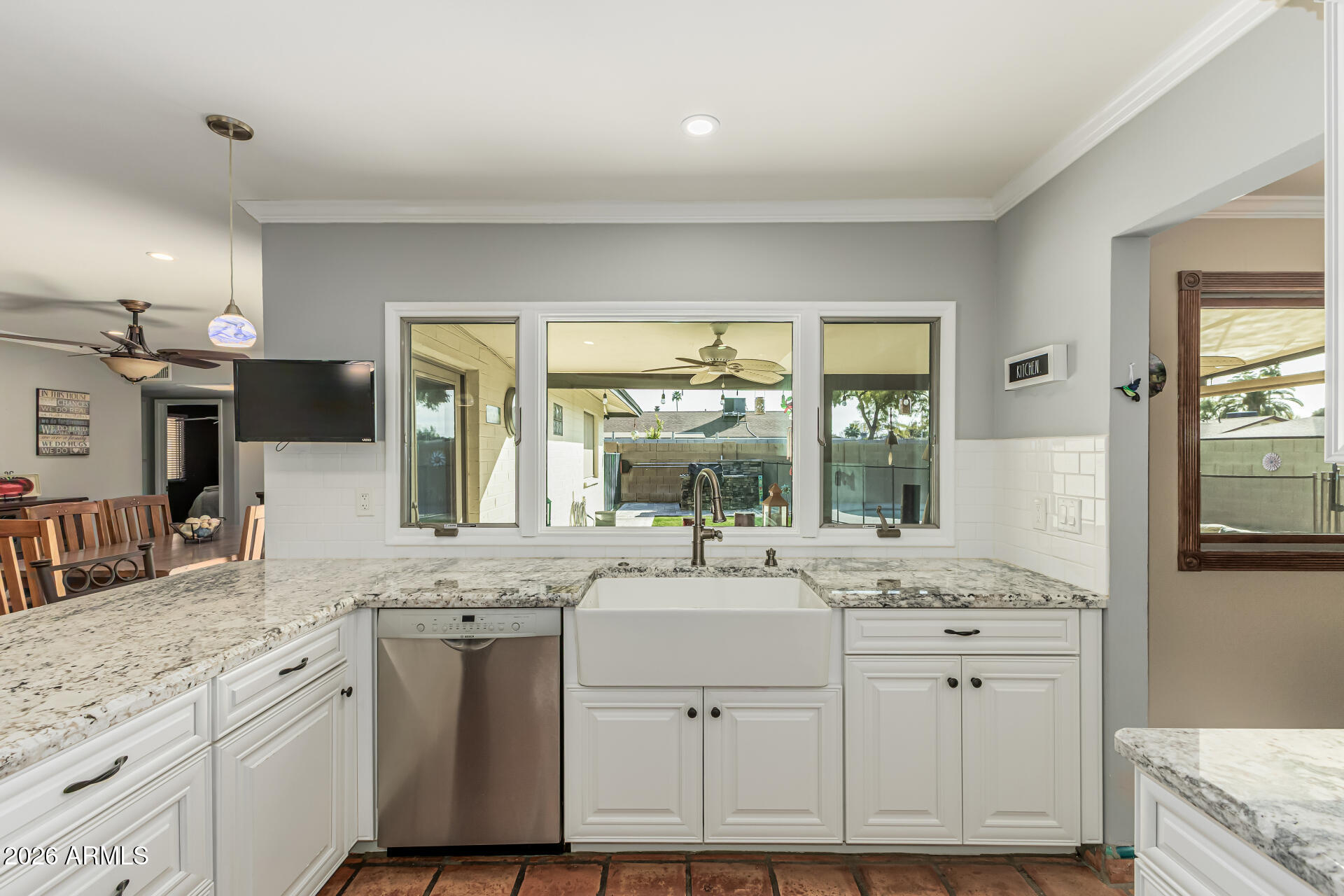 1003 East Watson Drive Tempe, AZ 85283 - Photo 13 of 39 a bathroom with a granite countertop toilet sink and mirror