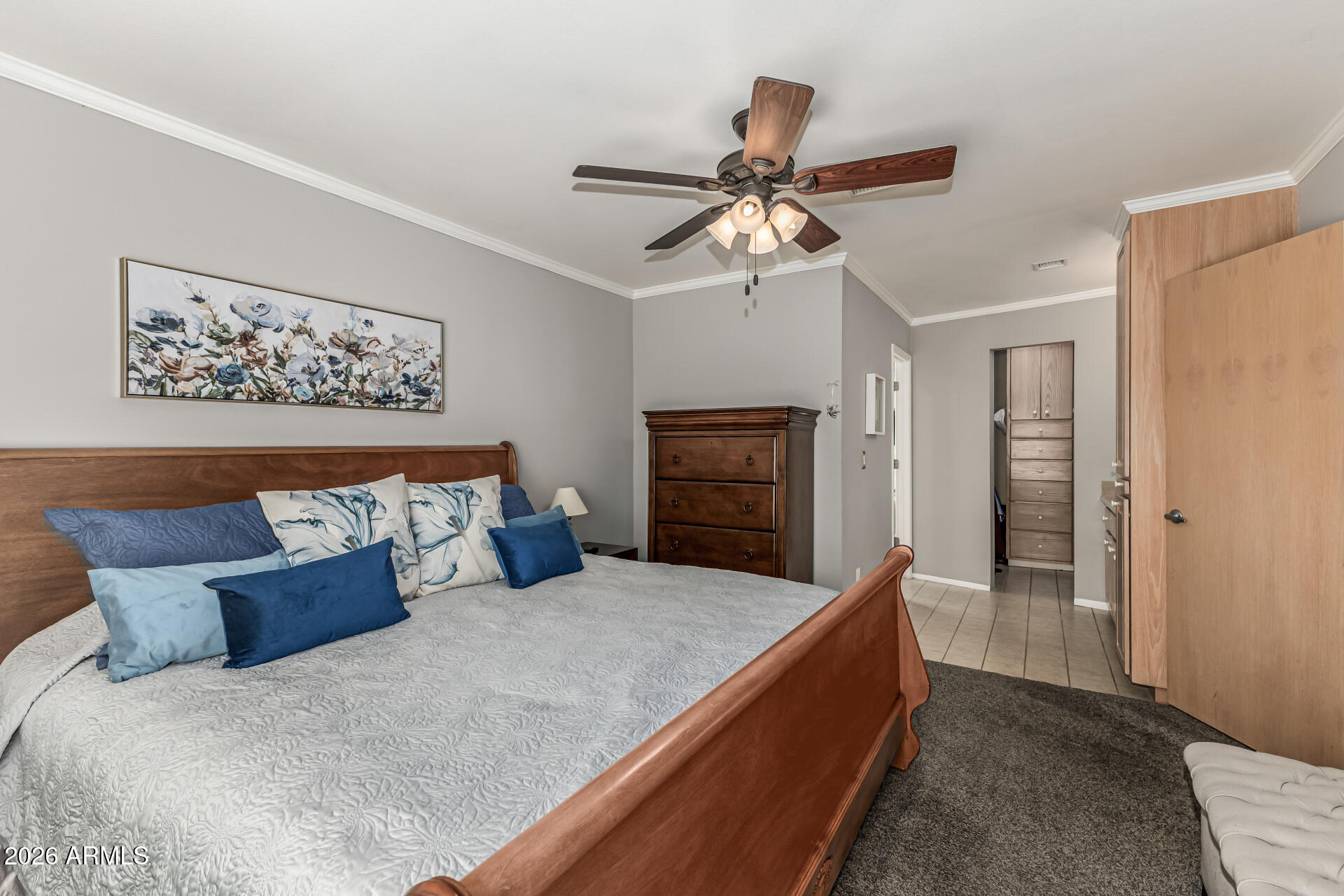 1003 East Watson Drive Tempe, AZ 85283 - Photo 18 of 39 a bed room with a bed and a chandelier