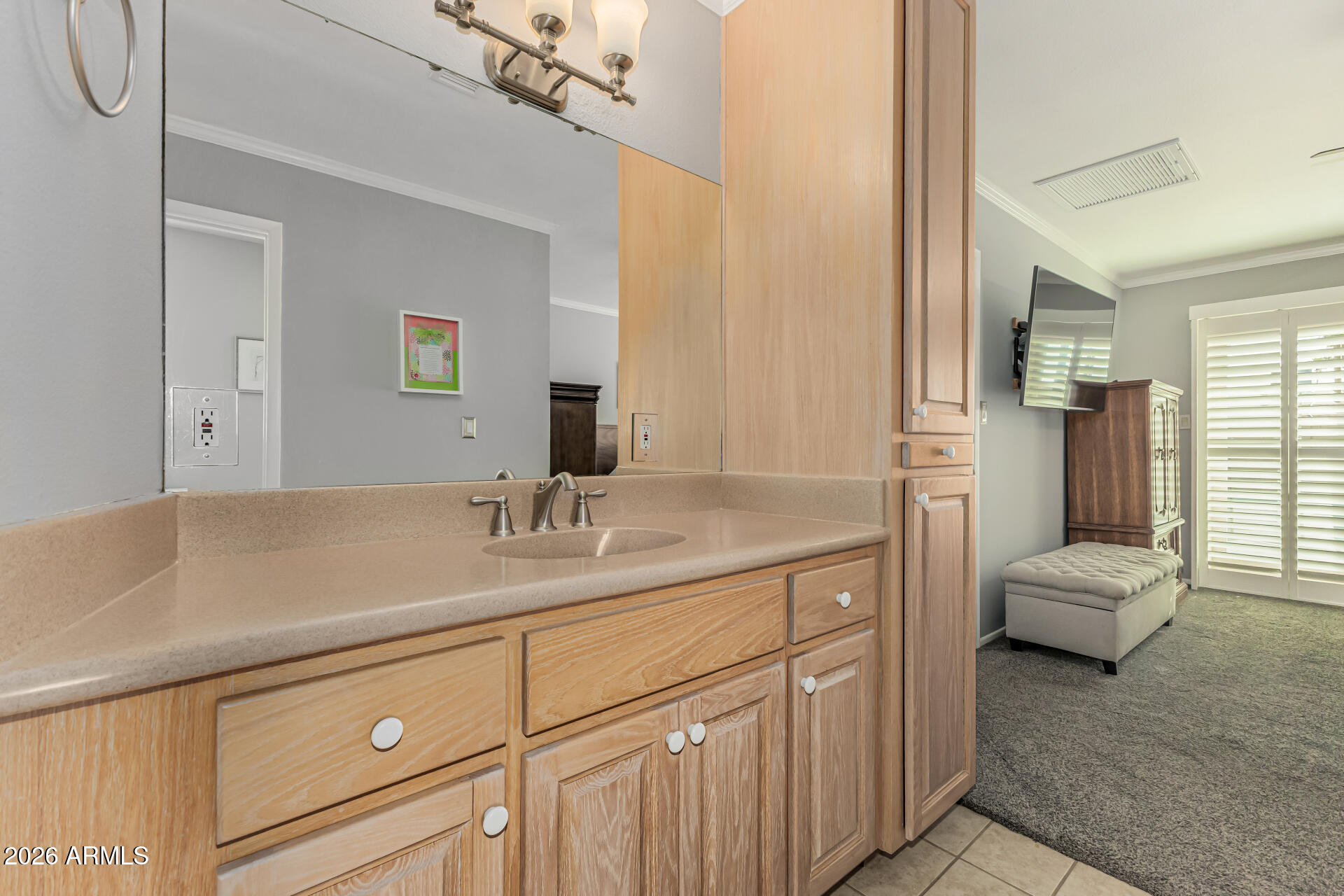 1003 East Watson Drive Tempe, AZ 85283 - Photo 19 of 39 a en suite bathroom with a sink and a mirror