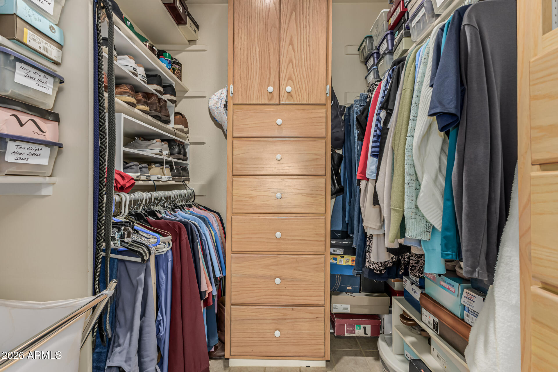 1003 East Watson Drive Tempe, AZ 85283 - Photo 22 of 39 a view of walk in closet with clothes and shoes