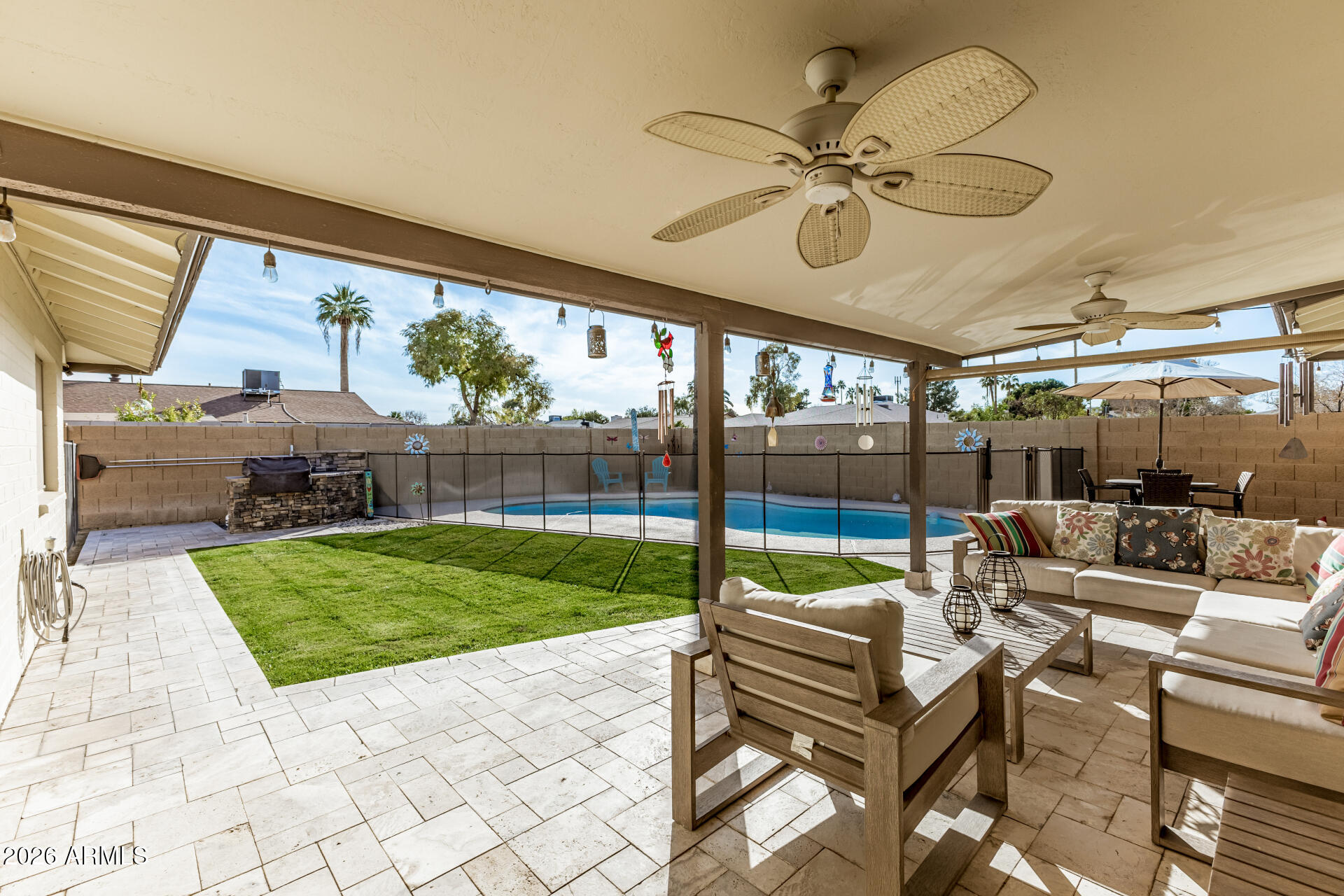 1003 East Watson Drive Tempe, AZ 85283 - Photo 33 of 39 a view of a patio with a dining table and chairs