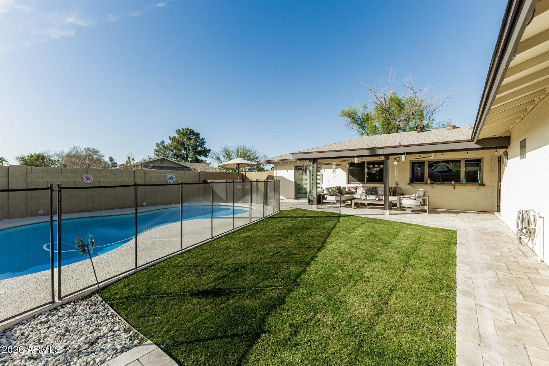 1003 East Watson Drive Tempe, AZ 85283 - Photo 34 of 39 a view of a house with swimming pool and sitting area