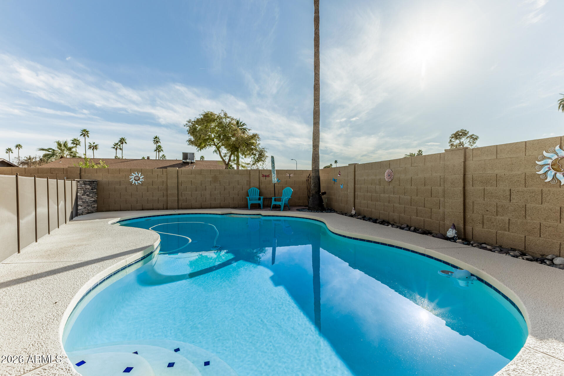1003 East Watson Drive Tempe, AZ 85283 - Photo 36 of 39 a view of a swimming pool with a lounge chairs