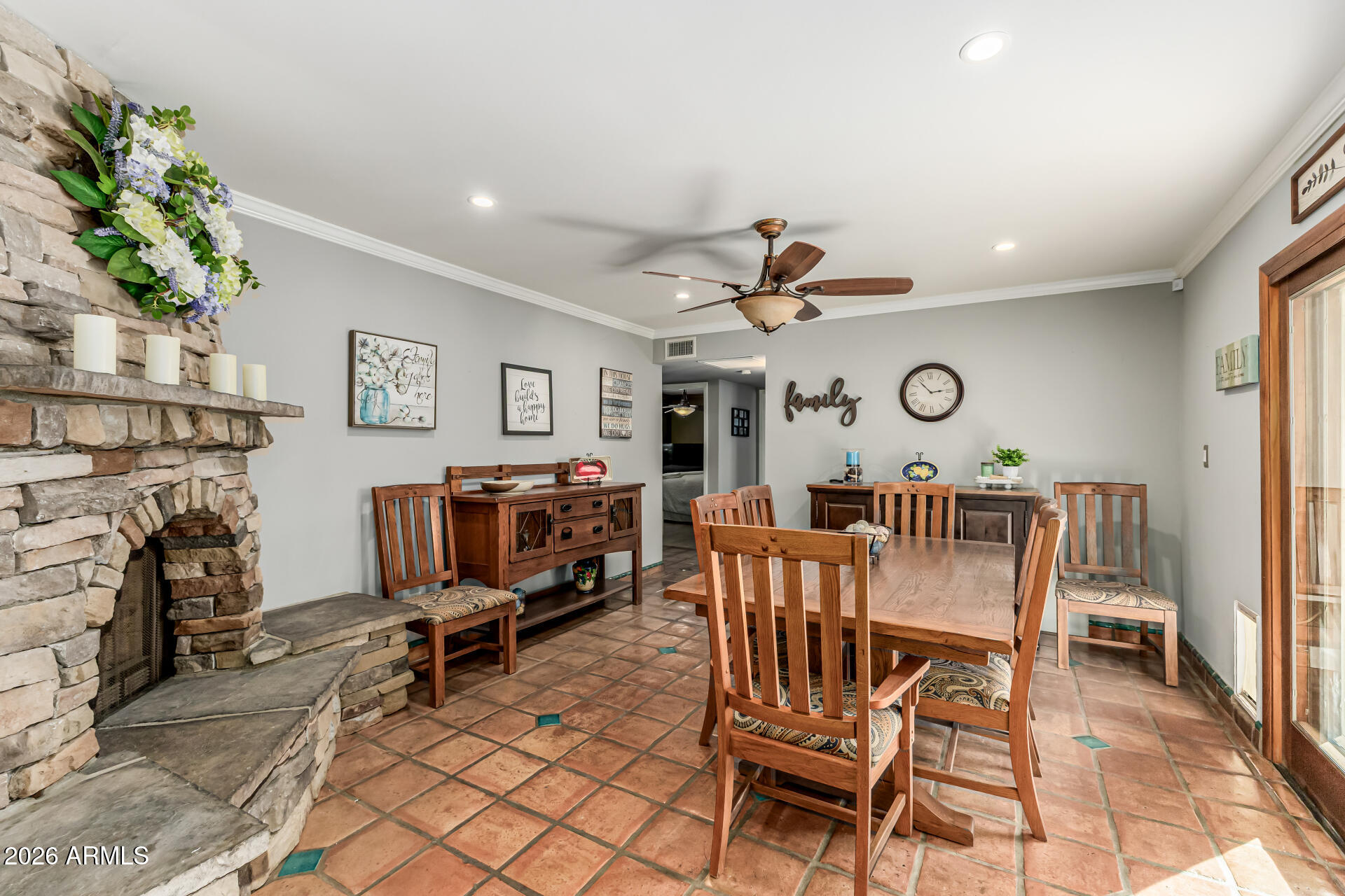 1003 East Watson Drive Tempe, AZ 85283 - Photo 9 of 39 a view of a livingroom and a dining room with furniture a fireplace and wooden floor