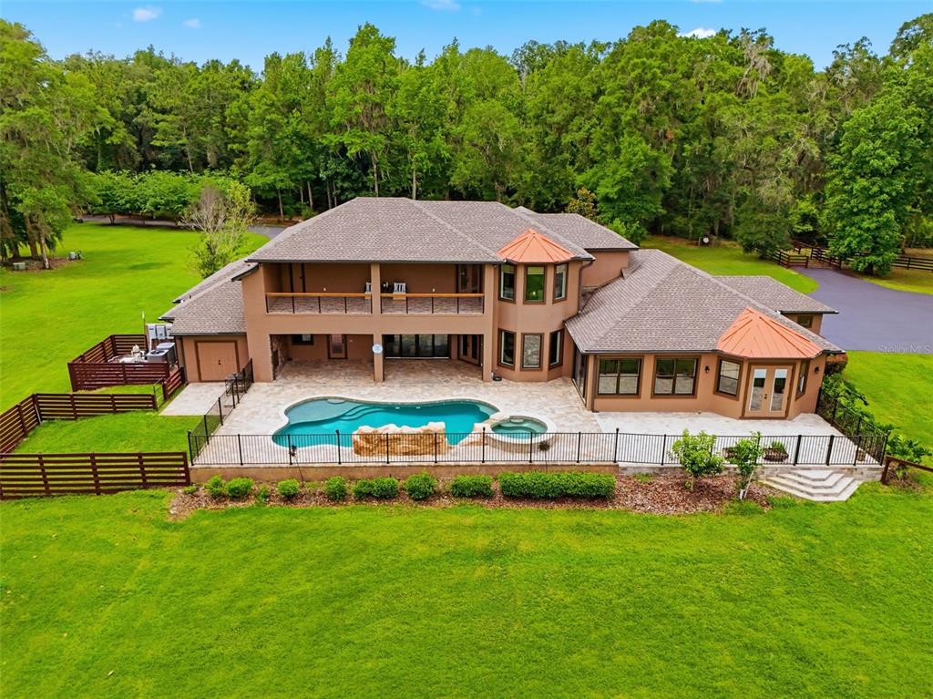 855 Southeast 87th Street Ocala, FL 34480 - Photo 75 of 79 a aerial view of a house with a big yard