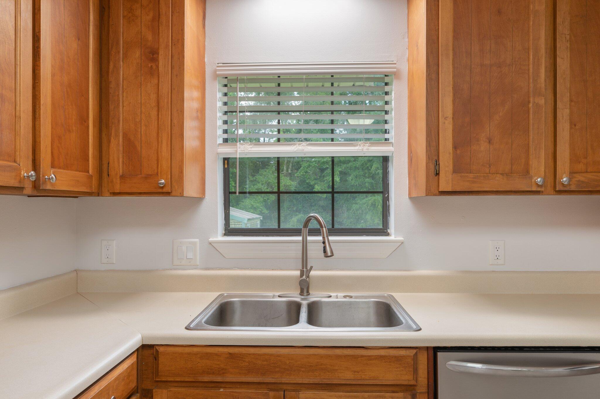 5903 Jack Stokes Road Baker, FL 32531 - Photo 14 of 35 a kitchen with a sink and large window