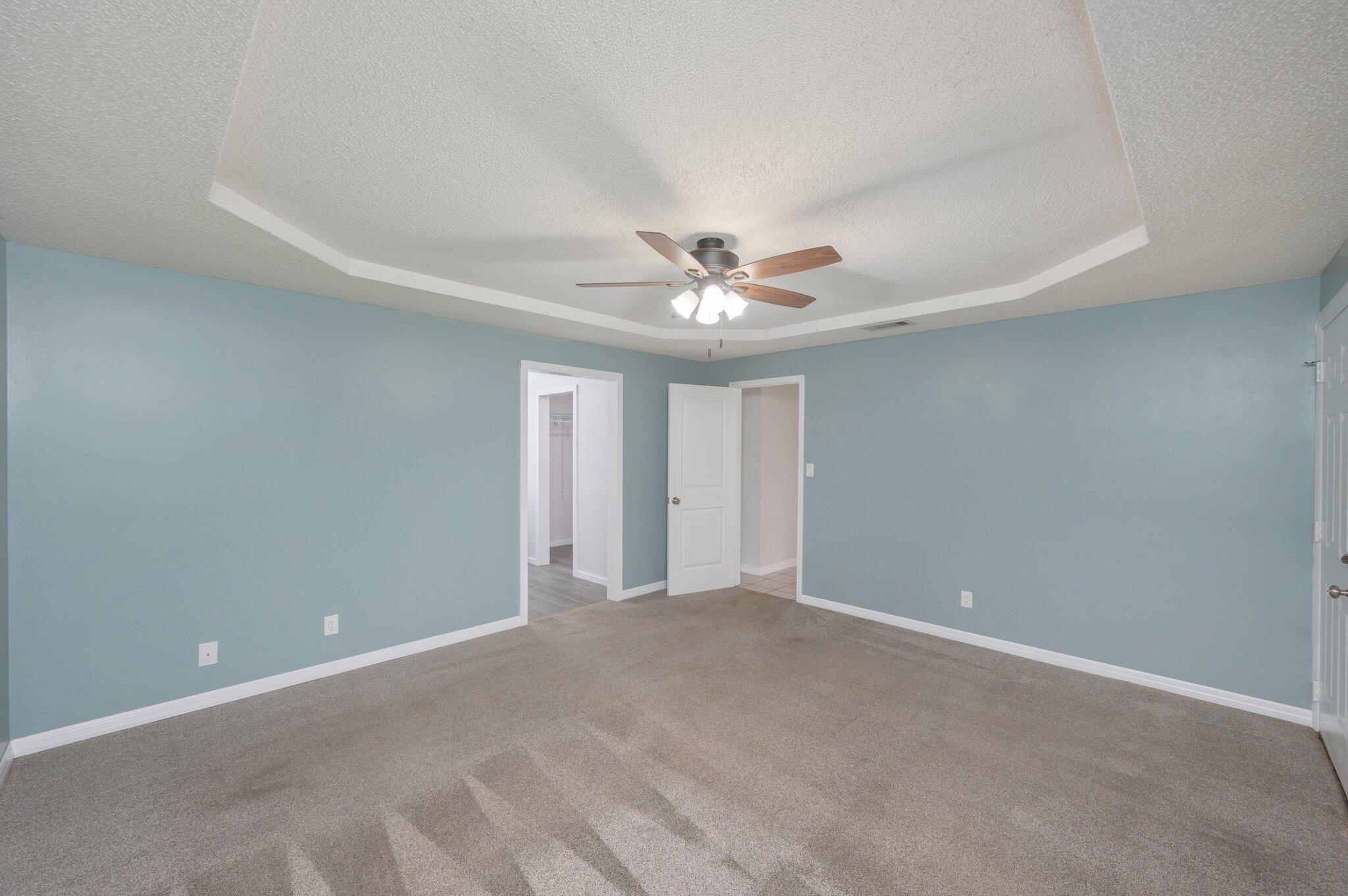 5903 Jack Stokes Road Baker, FL 32531 - Photo 18 of 35 a view of an empty room with a ceiling fan
